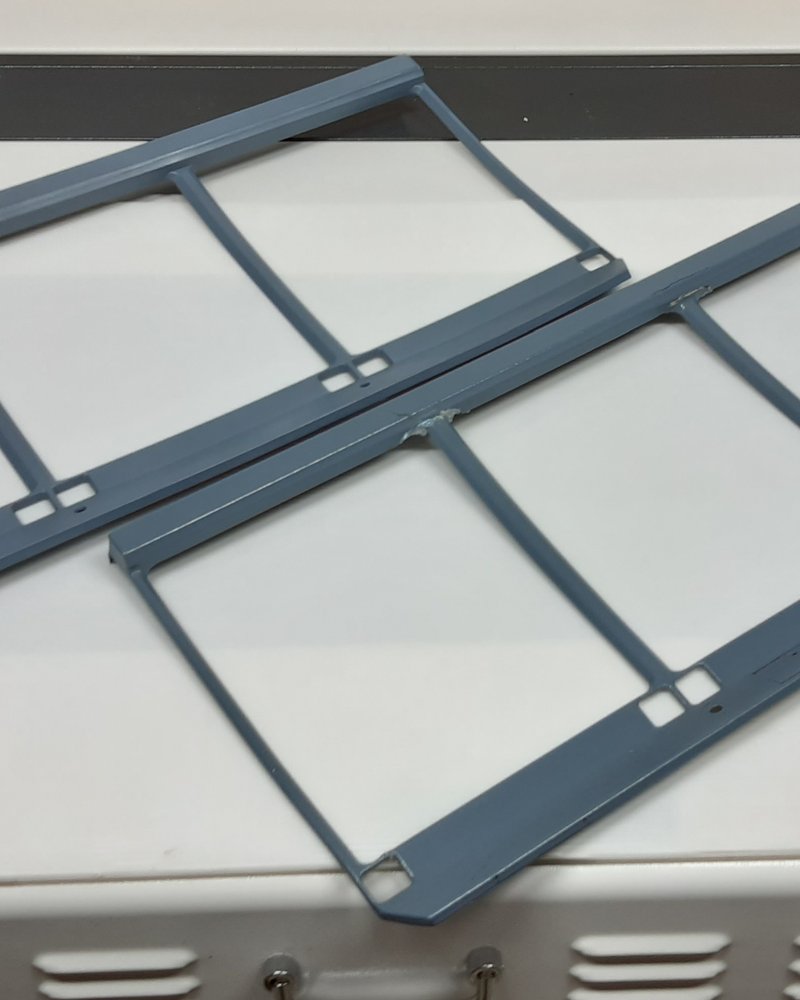 A matched pair of flight-simulator window frame panels, structurally repaired and repainted